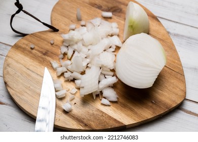 Diced Onion On A Wooden Cutting Board. Sliced White Onion.