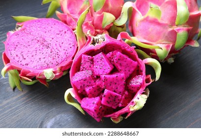 Diced Ripe Red Flesh Dragon Fruit or Pink Pitaya with Whole Fruits in the Backdrop