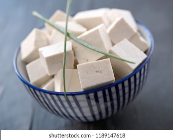 Diced Tofu In A Blue Bowl With Chives