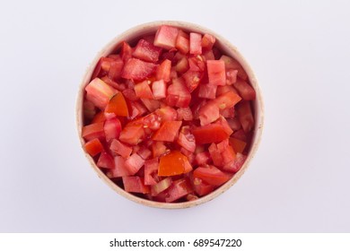 Diced Tomatoes Into A Bowl Isolated On White Background