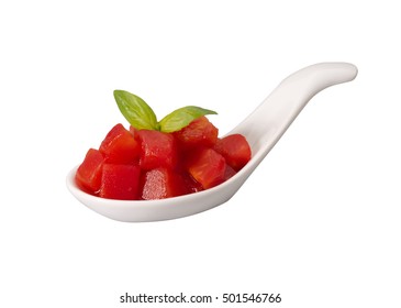 Diced Tomatoes In A Porcelain Spoon Isolated On White