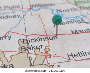 Dickinson, North Dakota marked by a green map tack.  The City of Dickinson is the county seat of Stark County, ND.