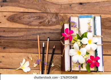 Dictionary Book, Diary  Bundle By Rope And Flowers Frangipani ,jasmine ,purple Flowers Arrangement Flat Lay Style On Background Wooden