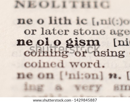 Dictionary definition of word neologism, selective focus.