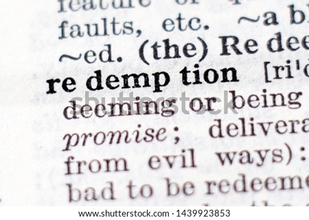 Dictionary definition of word redemption, selective focus.