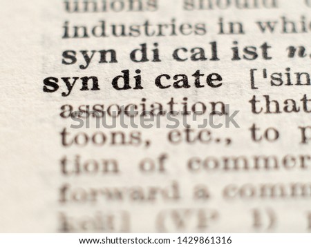 Dictionary definition of word syndicate, selective focus.