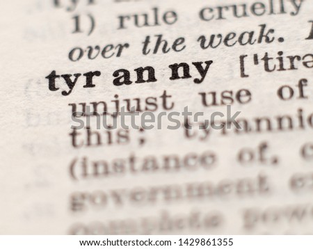 Dictionary definition of word tyranny, selective focus.