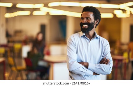 I Did Well For Myself. Shot Of A Confident Businessman Working In A Modern Office.