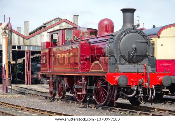 DIDCOT, OXFORDSHIRE, UK - MAY 4, 2014: An\
immaculate Metropolitan Railway E Class 0-4-4T No.1 stands outside\
the shed at the Didcot Railway Centre, during Great Western and\
Metropolitan Railways\
Gala.