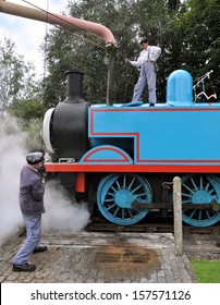 DIDCOT, UK - OCTOBER 5. Thomas The Tank Engine Is A Live Steam Locomotive, Based On Books By The Reverend Wilbert Awdry, Taking On Water On October 5, 2013 At Didcot Railway Centre, Oxfordshire, UK. 