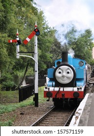 DIDCOT, UK - OCTOBER 5. Thomas The Tank Engine Is A Live Steam Locomotive, Based On Books By The Reverend Wilbert Awdry, Running On October 5, 2013 At Didcot Railway Centre, Oxfordshire, UK. 