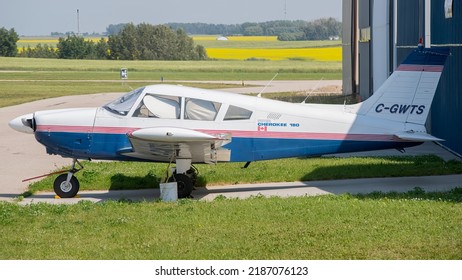 Didsbury, Alberta, Canada. August 01, 2022. A Piper PA-28-100 training flight plane sitting outside a hanger at Didsbury airport - Shutterstock ID 2187076123