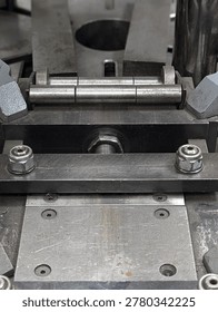 Die Cavity And Pin Alignment Closeup Showing Small Cylindrical Pins Guide Slots And Bolted Base Used For Precision Punching Trimming And Component Indexing