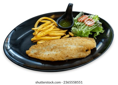 Die cut of Dolly Fish Steak and French fries with salad in black plate on white isolated.