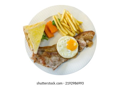 Die Cut Of Pork Steak With French Fries, Fried Eggs, Toast On White Plate, On White Isolated.