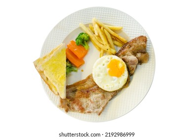 Die Cut Of Pork Steak With French Fries, Fried Eggs, Toast On White Plate, On White Isolated.