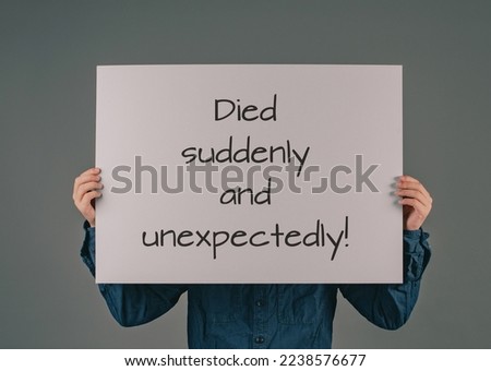 Died suddenly and unexpectedly, young man holds sign, clarification of the increase of mortality, death rate covid-19 jab