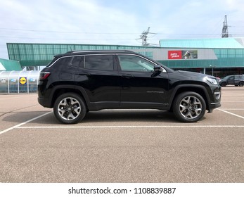 Diemen, Netherlands - June 9, 2018: Black Jeep Compass parked on a public parking lot. Nobody in the vehicle