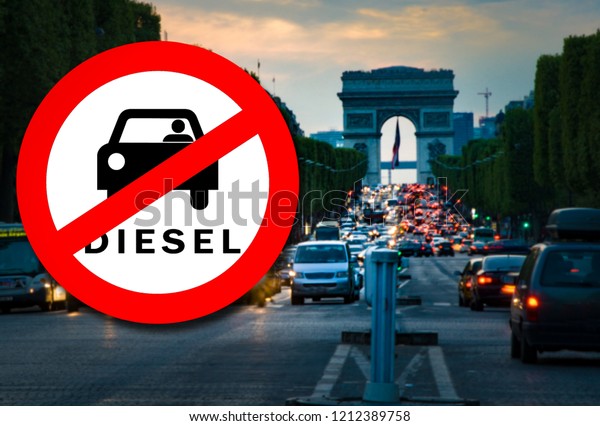 Diesel car\
Prohibition sign and Paris street with busy traffic blurred on the\
background. Symbolizing that Paris will be among the first European\
cities to ban diesels in\
2024