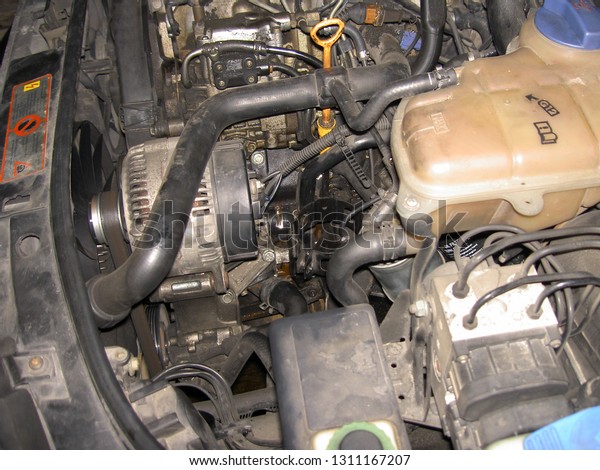 Diesel engine in the car during the fuel filter\
change, image