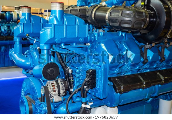 Diesel engine\
close up. Fragment of a diesel engine. Fragment of an electric\
generator. Marine diesel engine close-up. Industrial electric\
generator. Production\
generators.