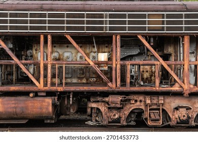 A diesel engine exposed through frame of a locomotive