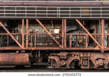 A diesel engine exposed through frame of a locomotive