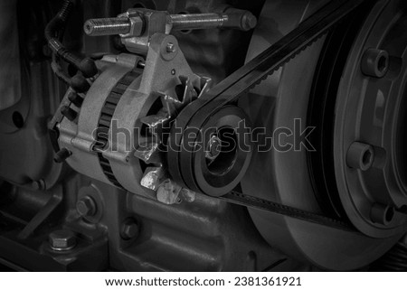 Diesel engine. Fragment of a diesel motor close-up. Engine details  Diesel engine  backgroundbackground. Belt drive of Diesel engine electric generator.  industrial technology concept background