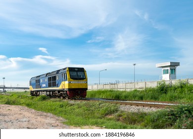 diesel engine train head run on railway track with cloudy and blue sky