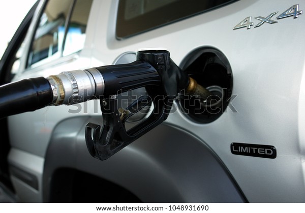 Diesel fueling at the gas station.\
Price concept of gasoline and diesel fuel and fossil\
fuels