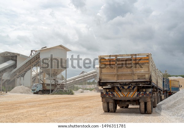 Diesel trucks used in modern\
mines and quarries for hauling industrial quantities of ore or\
coal.