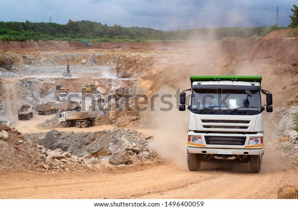 Diesel trucks used in modern\
mines and quarries for hauling industrial quantities of ore or\
coal.