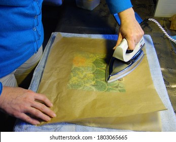 Diest, Belgium - January 12 2020: Ironing beeswax wrap with to melt beeswax. Image by Raphaëlla Goyvaerts