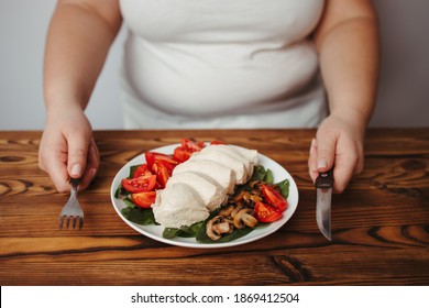 Diet Concept, Healthy Lifestyle, Low Calorie Food, Low Carb Diet. Fat Woman Eating Baked Chicken Breasts With Salad, Close Up