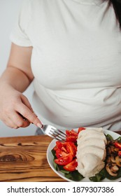 Diet Concept, Healthy Lifestyle, Low Calorie Food, Low Carb Diet. Fat Woman Eating Boiled Chicken Breasts With Salad, Close Up