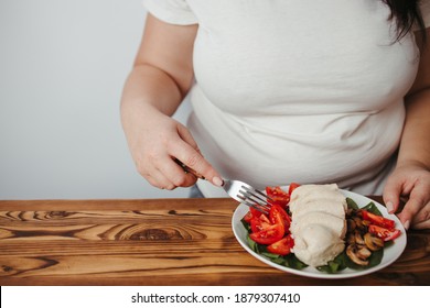 Diet Concept, Healthy Lifestyle, Low Calorie Food, Low Carb Diet. Fat Woman Eating Boiled Chicken Breasts With Salad, Close Up