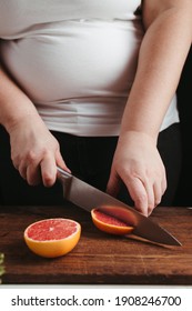 Diet Concept, Healthy Lifestyle, Low Calorie Food. Overweight Woman Cooking Healthy Dinner Of Fresh Juicy Fruits