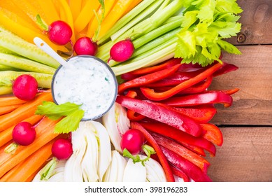 Diet Concept Rainbow Vegetables Plate With Dip On Rustic Wood Background.Healthy Vegetarian Food Concept.