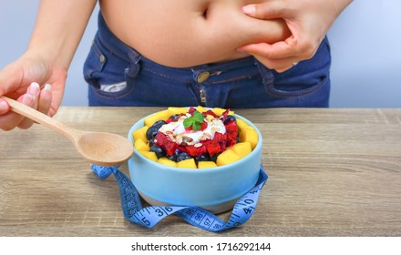 Diet Concept And Weight Loss Which Young  Woman Measuring Her Waist  As  Eating Healthy Food And Yogurt Parfait