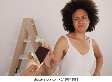 Diet Concept. Woman Refuses To Eat Chocolate.