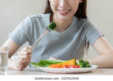 Diet, Dieting Asian Young Woman Or Girl Use Fork At Broccoli On Mix Vegetables, Green Salad Bowl, Eat  Food Is Low Fat Good Health. Nutritionist Female, Weight Loss For Healthy Person.