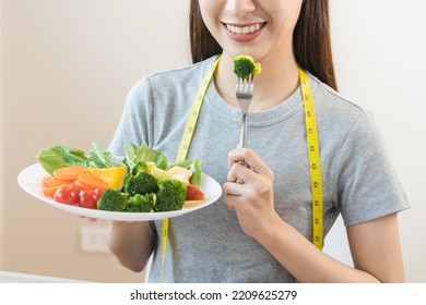 Diet, Dieting Asian Young Woman Or Girl Use Fork At Broccoli On Mix Vegetables, Green Salad Bowl, Eat  Food Is Low Fat Good Health. Nutritionist Female, Weight Loss For Healthy Person.
