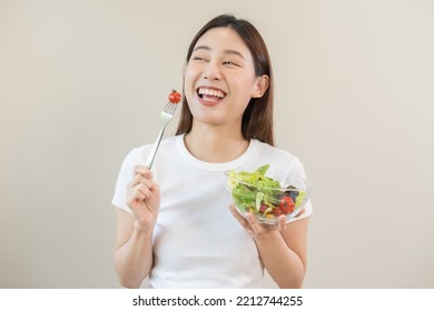 Diet, Dieting Asian Young Woman Or Girl Use Fork At Tomato On Mix Vegetables, Green Salad Bowl, Eat  Food Is Low Fat Good Health. Nutritionist Female, Weight Loss For Healthy Person.