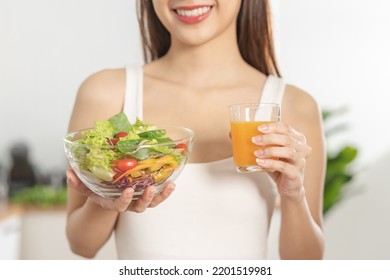 Diet, Dieting, Pretty Asian Young Woman Or Girl Smiling, Holding Glass Of Orange Juice And Mix Vegetables, Green Salad Bowl. Eat Food Is Low Fat Good Healthy. Nutritionist Weight Loss Health Person.