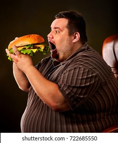 Diet Failure Of Fat Man Eating Fast Food Hamberger. Happy Smile Overweight Person Who Spoiled Healthy Food By Eating Huge Hamburger On Fork. Hate To Diets. Very Fat Man Eating Fast Food.