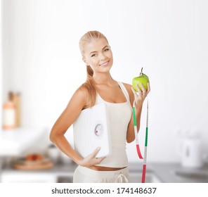 Diet And Fitness Concept - Beautiful Sporty Woman With Scale, Green Apple And Measuring Tape