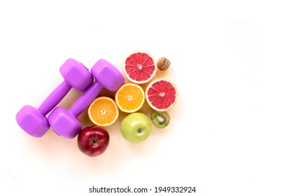 Diet And Fresh Food With Pink Dumbbells. Diet Plan, Health And Nutrition Program For A Healthy Lifestyle. Top View Of The Background