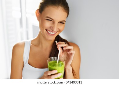 Diet. Healthy Eating Woman Drinking Fresh Raw Green Detox Vegetable Juice. Healthy Lifestyle, Vegetarian Food And Meal. Drink Smoothie. Nutrition Concept.