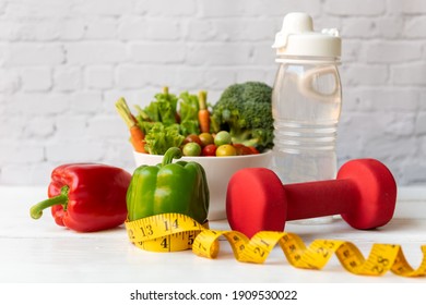 Diet Healthy Food And Lifestyle Health Concept. Sport Exercise Equipment Workout and gym Background With Nutrition Detox Salad For Fitness Style. Healthy Concept