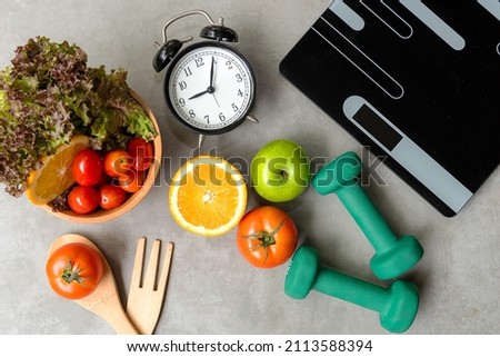Diet and Healthy life loss weight exercise Concept. Fresh fruits salad vegetable with Weight scale measure prevention for women diet slimming. Lifestyle Time and Healthy	